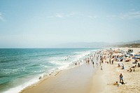 Crowded beach on sunny day, people on vacation. Original public domain image from Wikimedia Commons