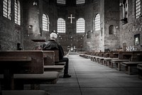 Priest praying at church. Original public domain image from <a href="https://commons.wikimedia.org/wiki/File:Stefan_Kunze_2015_(Unsplash).jpg" target="_blank">Wikimedia Commons</a>