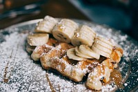 A waffle covered in powdered sugar and waffles in Las Vegas. Original public domain image from Wikimedia Commons
