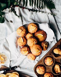 Basket of freshly baked orange muffins. Original public domain image from Wikimedia Commons
