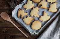 Baked cookies in the shape of cats, ghosts and witches. Original public domain image from <a href="https://commons.wikimedia.org/wiki/File:Halloween_cookie_tray_(Unsplash).jpg" target="_blank">Wikimedia Commons</a>