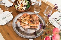 Christmas turkey served on a table. Original public domain image from <a href="https://commons.wikimedia.org/wiki/File:Lausanne,_Switzerland_(Unsplash).jpg" target="_blank">Wikimedia Commons</a>