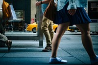 A low shot of people's legs on a sidewalk on Fifth Avenue. Original public domain image from <a href="https://commons.wikimedia.org/wiki/File:Pedestrians%27_Feet_(Unsplash).jpg" target="_blank" rel="noopener noreferrer nofollow">Wikimedia Commons</a>