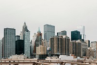 The New York City skyline against a white, cloudy sky with tall skyscrapers. Original public domain image from <a href="https://commons.wikimedia.org/wiki/File:Almost_home_(Unsplash).jpg" target="_blank" rel="noopener noreferrer nofollow">Wikimedia Commons</a>