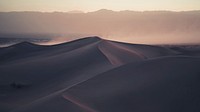 Rolling desert dunes covered in fog in Text. Original public domain image from Wikimedia Commons
