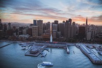 A drone shot of the Port of San Francisco with the city skyline at the back. Original public domain image from <a href="https://commons.wikimedia.org/wiki/File:Port_of_San_Francisco_skyline_(Unsplash).jpg" target="_blank" rel="noopener noreferrer nofollow">Wikimedia Commons</a>