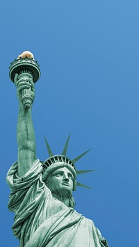 Statue of Liberty phone wallpaper, blue sky background