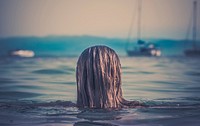 Woman with wet hair in sea. Original public domain image from <a href="https://commons.wikimedia.org/wiki/File:Woman%27s_head_above_the_water_(Unsplash).jpg" target="_blank">Wikimedia Commons</a>