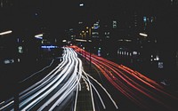 Red and white car light trails on an urban highway at night in Röddingsmarkt. Original public domain image from <a href="https://commons.wikimedia.org/wiki/File:Leon_Christopher_2017_(Unsplash).jpg" target="_blank" rel="noopener noreferrer nofollow">Wikimedia Commons</a>
