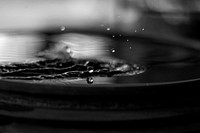 Water droplet splashing background. Original public domain image from <a href="https://commons.wikimedia.org/wiki/File:Monochrome_water_splash_macro_(Unsplash).jpg" target="_blank">Wikimedia Commons</a>