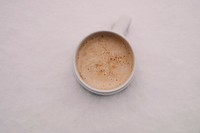 A frothy cup of coffee in a white mug in Oradea. Original public domain image from <a href="https://commons.wikimedia.org/wiki/File:Oradea_coffee_cup_(Unsplash).jpg" target="_blank" rel="noopener noreferrer nofollow">Wikimedia Commons</a>