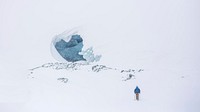 A landscape of a hiker walking in the snow to a ice cave. Original public domain image from <a href="https://commons.wikimedia.org/wiki/File:Hiker_heading_to_ice_cave_(Unsplash).jpg" target="_blank" rel="noopener noreferrer nofollow">Wikimedia Commons</a>