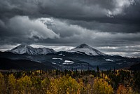 Snow-capped mountains under a gray sky in Silverthorne. Original public domain image from Wikimedia Commons
