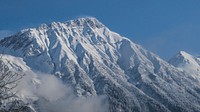 A tall snow-covered peak in Innsbruck. Original public domain image from <a href="https://commons.wikimedia.org/wiki/File:It%27s_all_in_that_pow._(Unsplash).jpg" target="_blank" rel="noopener noreferrer nofollow">Wikimedia Commons</a>