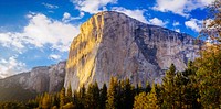 Sunlight illuminates the face of the El Capitan rock formation in Yosemite. Original public domain image from <a href="https://commons.wikimedia.org/wiki/File:El_Capitan_on_a_sunny_day_(Unsplash).jpg" target="_blank" rel="noopener noreferrer nofollow">Wikimedia Commons</a>