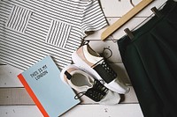 Flat lay photography comprises of women's clothes, shoes, and a notebook in London.. Original public domain image from Wikimedia Commons