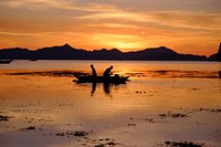 Fisherman, boat, beach,sunset, reflection. Original public domain image from Wikimedia Commons