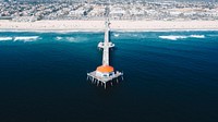 Drone view of the pier on the Huntington Beach coastline. Original public domain image from <a href="https://commons.wikimedia.org/wiki/File:Drone_view_of_the_pier_(Unsplash).jpg" target="_blank" rel="noopener noreferrer nofollow">Wikimedia Commons</a>