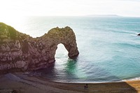View of the rock formation at the sand beach in Durdle Door. Original public domain image from Wikimedia Commons
