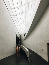 A ramp along a curved wall in the Kiasma Museum. Original public domain image from <a href="https://commons.wikimedia.org/wiki/File:Museum_ramp_(Unsplash).jpg" target="_blank" rel="noopener noreferrer nofollow">Wikimedia Commons</a>
