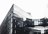 The glass facade of a modern office building in London. Original public domain image from <a href="https://commons.wikimedia.org/wiki/File:Glass_wall_(Unsplash).jpg" target="_blank" rel="noopener noreferrer nofollow">Wikimedia Commons</a>