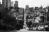A person skateboarding down a huge hill in San Francisco. Original public domain image from Wikimedia Commons