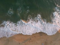 Ocean waves washing sandy beach, drone view, aerial view. Original public domain image from <a href="https://commons.wikimedia.org/wiki/File:Drone_view_of_sand_coastline_(Unsplash).jpg" target="_blank">Wikimedia Commons</a>