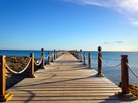 Pier at the sea coast. Original public domain image from Wikimedia Commons