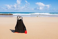 Scuba diving fins in the fine sand beach at Fuerteventura. Original public domain image from <a href="https://commons.wikimedia.org/wiki/File:Scuba_fins_on_the_beach_(Unsplash).jpg" target="_blank" rel="noopener noreferrer nofollow">Wikimedia Commons</a>