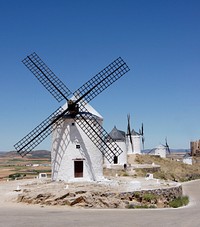 Windmills on the hill of Consuegra, Castile La Mancha, Spain. The one in foreground is named "Rucio". Original public domain image from Wikimedia Commons