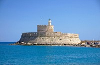 As seen from the sea, the fort Saint Nicolas (and lighthouse), 14th century, entrance of the old harbour of Rhodes, Greece. Original public domain image from Wikimedia Commons