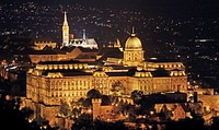 Matthias Church and buda castle ariel view at night. Original public domain image from Wikimedia Commons