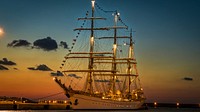 Romanian sail training ship Mircea berthed in a harbour at night. Original public domain image from <a href="https://commons.wikimedia.org/wiki/File:Mircea_at_night-843085.jpeg" target="_blank">Wikimedia Commons</a>
