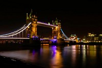 Tower Bridge of London at night. Original public domain image from Wikimedia Commons
