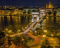 Széchenyi Chain Bridge in Budapest pictured at night. Original public domain image from Wikimedia Commons