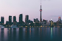 Toronto buildings in twilight from waterside. Original public domain image from Wikimedia Commons