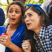 Female baseball supporters watching their team loose the game