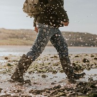 Tourist walking through the beach side trail in Wales 