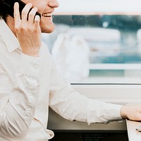 Man working in a laptop on his business trip on a train 