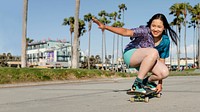 Girl skateboarding, fun outdoors sport activity in Los Angeles