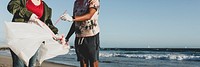 Young environmentalist friends, beach clean up volunteering