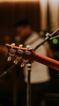 Musician playing guitar background, aesthetic photography