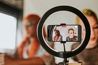 Drag queen beauty blogger recording a makeup tutorial video