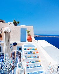Scenic of Oia traditional white painted house with Aegean sea view in Santorini, Greece