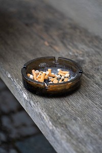 Ashtray filled with cigarette butts and ashes