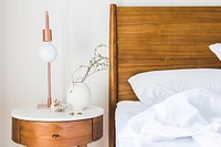 Free teak table and headboard in a brightly lit bedroom image, public domain design CC0 photo.