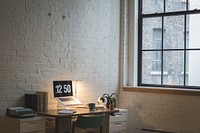 Free laptop in modern office with white brick wall and window view image, public domain CC0 photo.