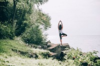 Free woman stands on a rock outdoors in a Yoga pose photo, public domain sport CC0 image.