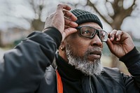 Cool senior African man with trendy glasses