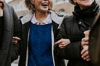 Retired friends walking together in the city